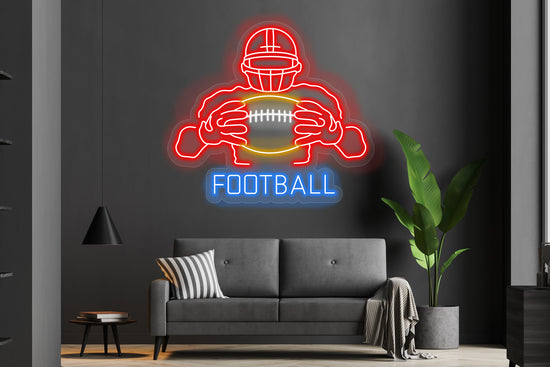 Football player with ball custom neon LED sign featuring vibrant glowing lights, perfect for sports enthusiasts or game room decor.